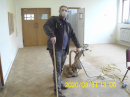 Work on sanding the block flooring in the small hall